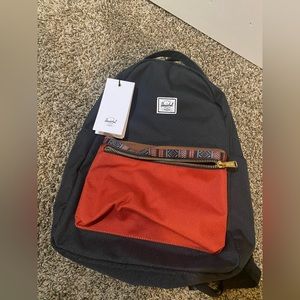 Herschel (new) with tag bought for €123